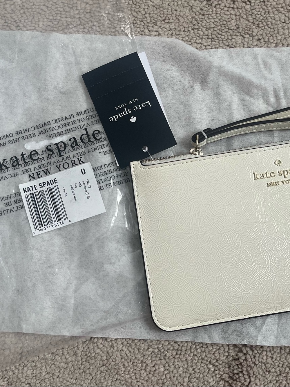 kate spade Cream Leather Wristlet with Gold Logo